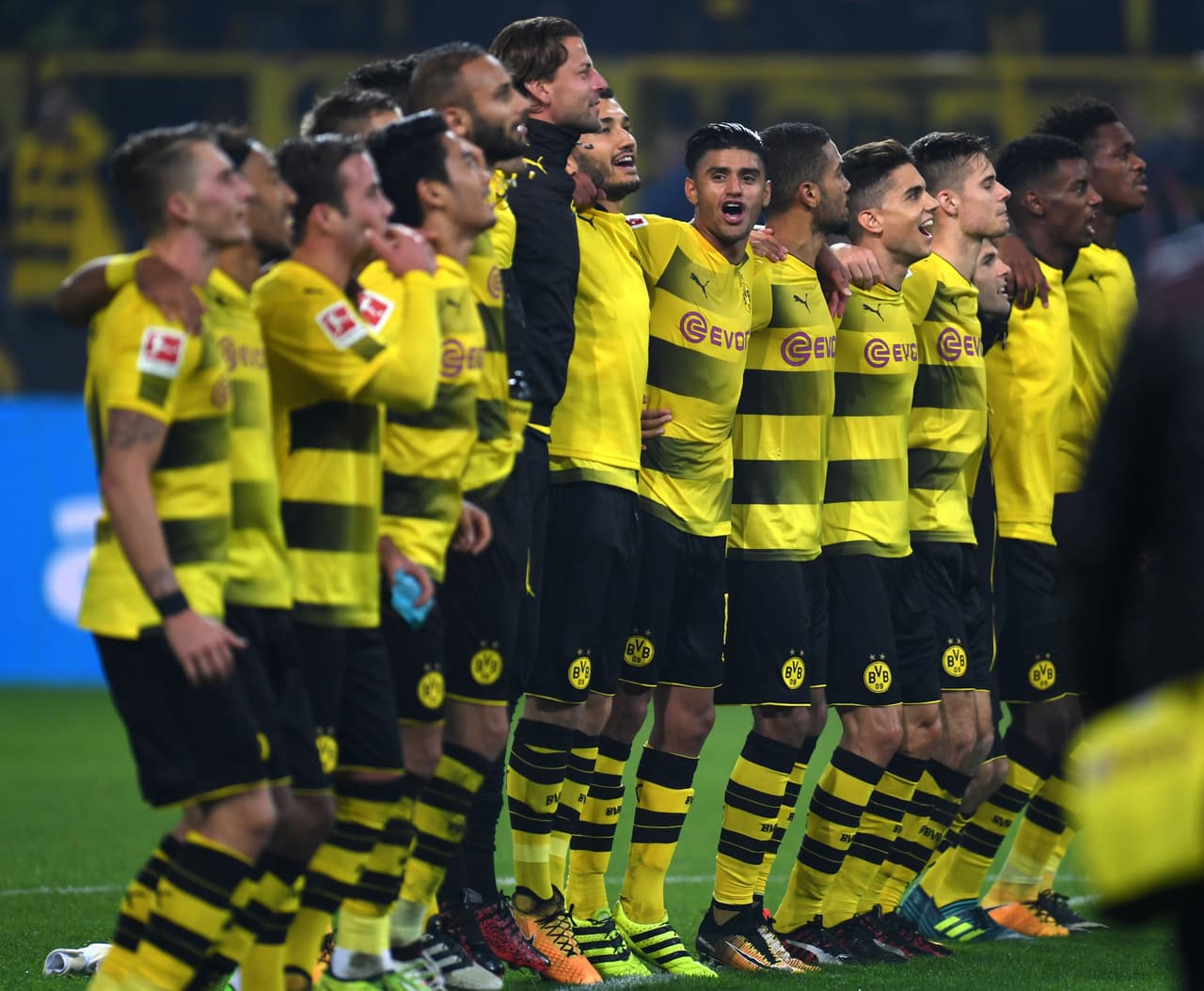 Dortmund's players celebrate after the German First division Bundesliga football match Borussia Dortmund vs Borussia Moenchengladbach in Dortmund, western Germany, on September 23, 2017. / AFP PHOTO / PATRIK STOLLARZ (Photo credit should read PATRIK STOLLARZ/AFP/Getty Images)