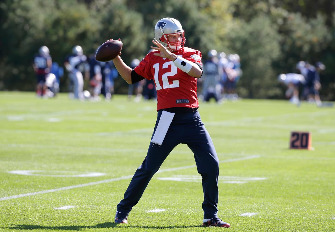 New England Patriots quarterback Tom Brady (12) winds up for a pass during an NFL football team practice Wednesday, Oct. 5, 2016, in Foxborough, Mass. (AP Photo/Steven Senne)