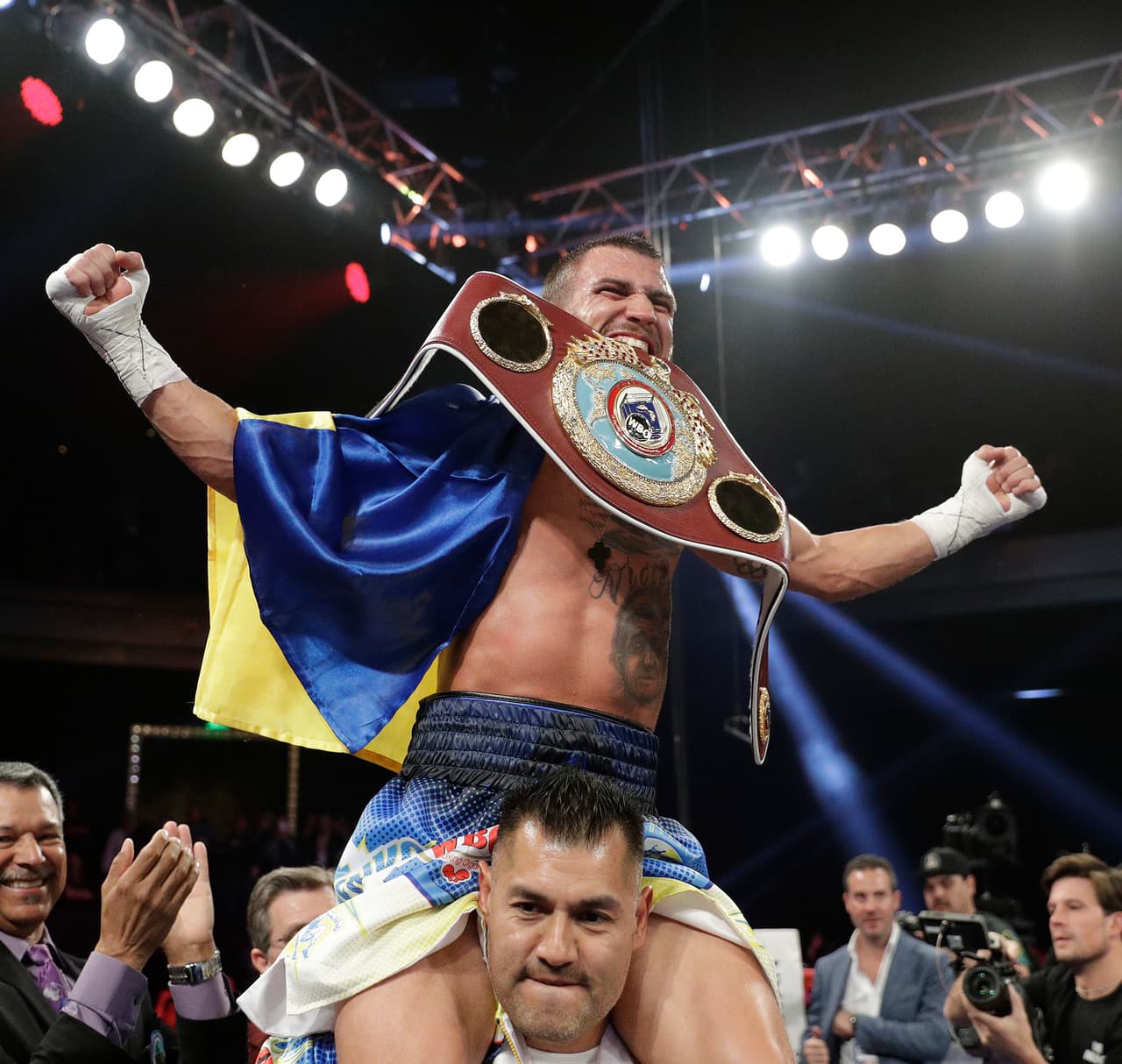 Vasyl Lomachenko, of Ukraine, celebrates after defeating Nicholas Walters, of Jamaica, in a WBO junior lightweight title boxing match Saturday, Nov. 26, 2016, in Las Vegas. (AP Photo/John Locher)