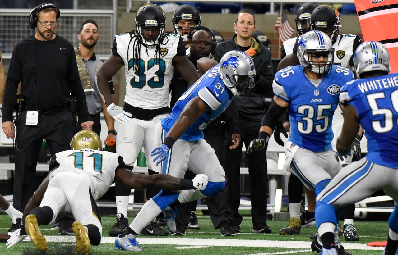 Detroit Lions strong safety Rafael Bush (31) runs an interception back for a 39-yard touchdown during the second half of an NFL football game against the Jacksonville Jaguars, Sunday, Nov. 20, 2016 in Detroit. (AP Photo/Jose Juarez)
