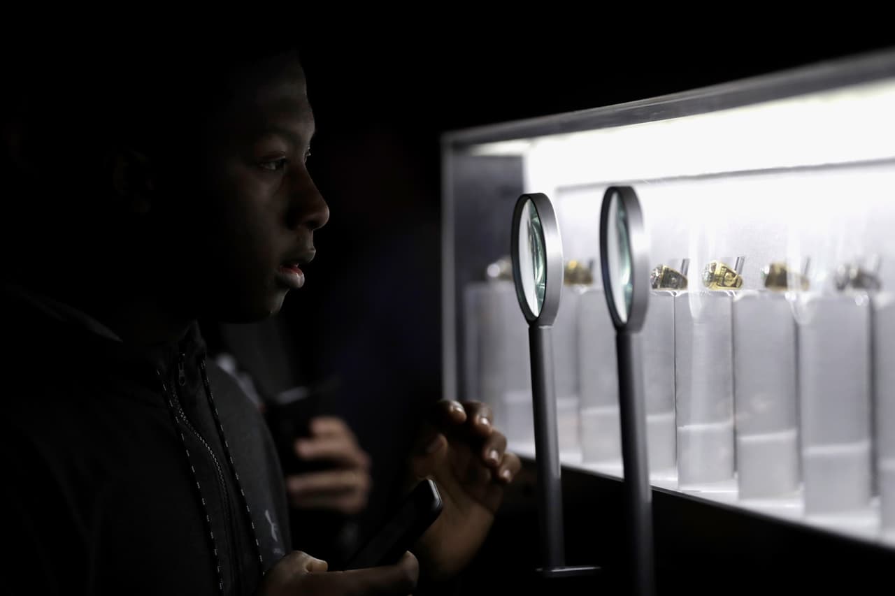 HOUSTON, TX - JANUARY 29: A fan views Super Bowl rings at the NFL Experience on January 29, 2017 in Houston, Texas. (Photo by Tim Warner/Getty Images)