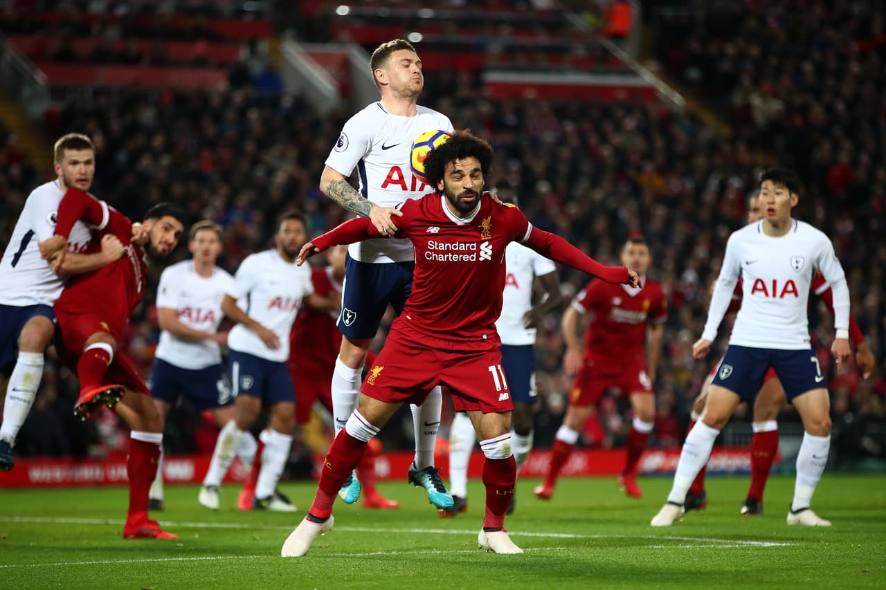 LIVERPOOL, ENGLAND - FEBRUARY 04: Kieran Trippier of Tottenham Hotspur competes for a header with Mohamed Salah of Liverpool during the Premier League match between Liverpool and Tottenham Hotspur at Anfield on February 4, 2018 in Liverpool, England. (Photo by Clive Brunskill/Getty Images)
