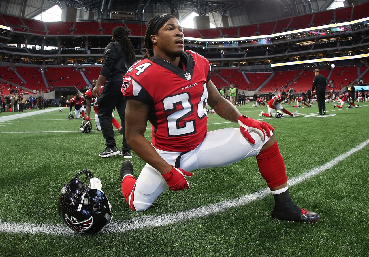 Atlanta Falcons running back Devonta Freeman (24) warms up before the first half of an NFL football game between the Atlanta Falcons and the Jacksonville Jaguars, Thursday, Aug. 31, 2017, in Atlanta. (AP Photo/John Bazemore)