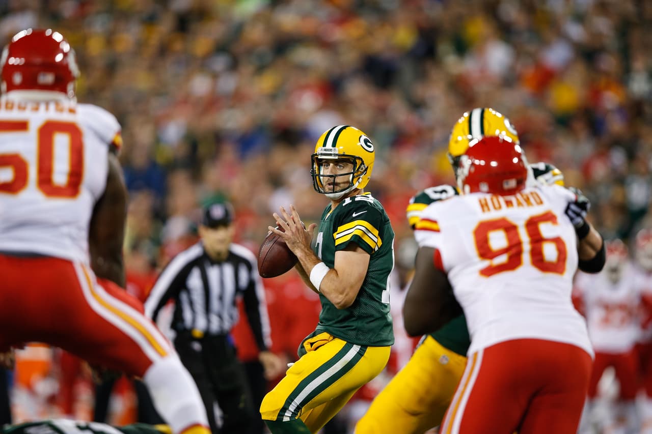 GREEN BAY, WI - SEPTEMBER 28: Quarterback Aaron Rodgers #12 of the Green Bay Packers looks to pass the football against the Kansas City Chiefs in the second half at Lambeau Field on September 28, 2015 in Green Bay, Wisconsin. The Green Bay Packers defeat the Kansas City Chiefs 38-28. (Photo by Joe Robbins/Getty Images)