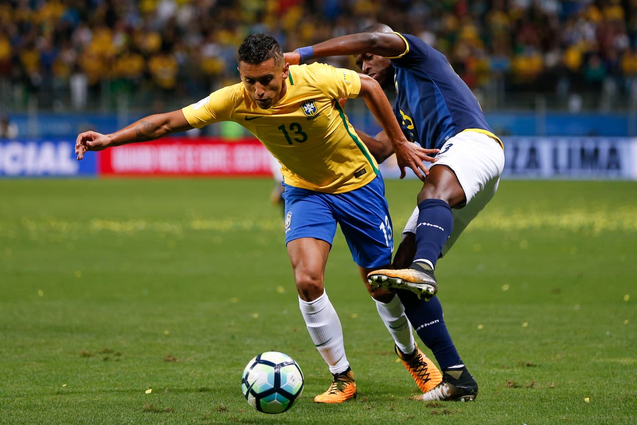 Brazil's Marquinhos, left, fights for the ball with Ecuador's Ender Valencia during a 2018 World Cup qualifying soccer match in Porto Alegre, Brazil, Thursday, Aug. 31, 2017. (AP Photo/Andre Penner)