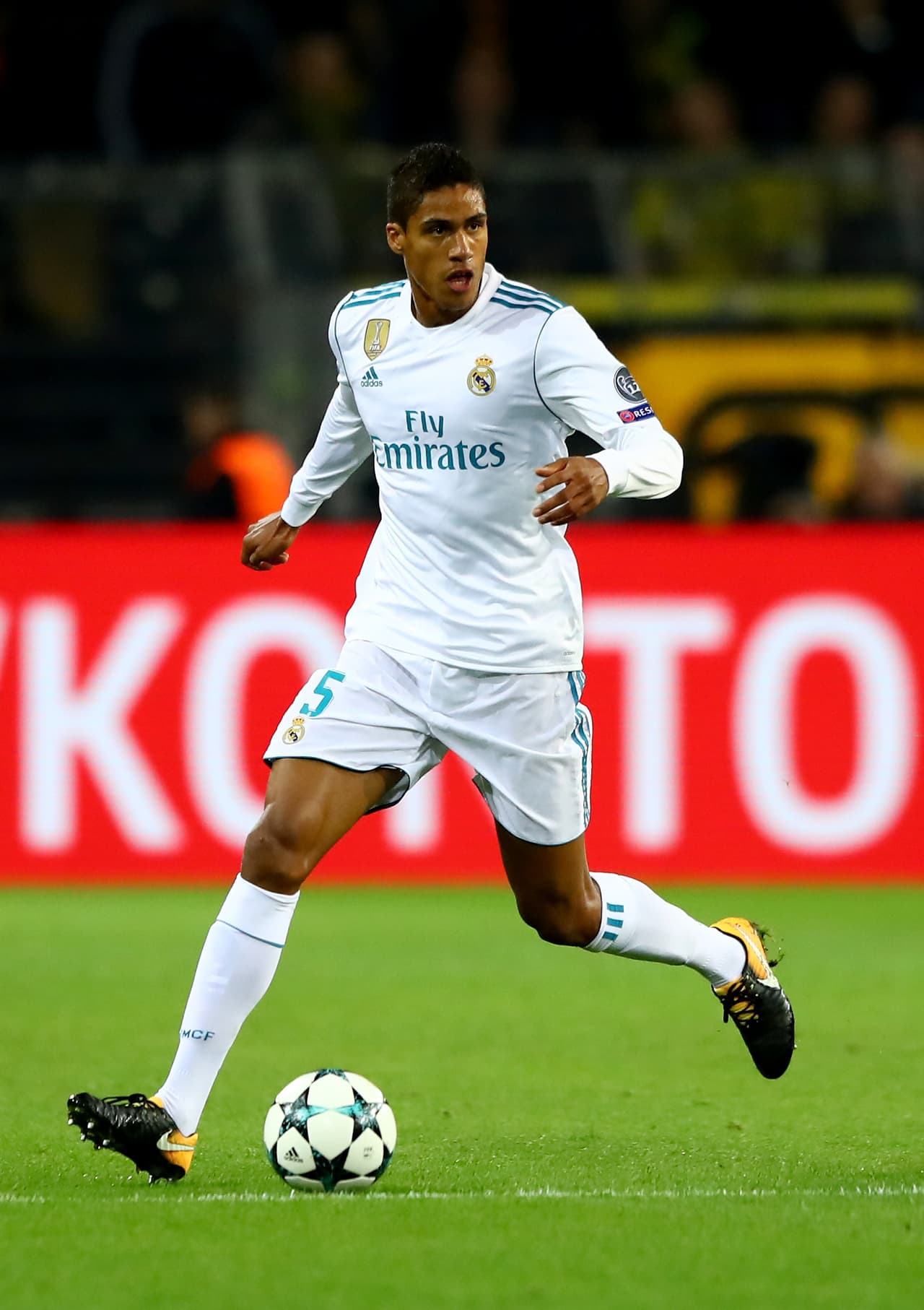 DORTMUND, GERMANY - SEPTEMBER 26: Raphael Varane of Real Madrid runs with the ball during the UEFA Champions League group H match between Borussia Dortmund and Real Madrid at Signal Iduna Park on September 26, 2017 in Dortmund, Germany. (Photo by Martin Rose/Bongarts/Getty Images)