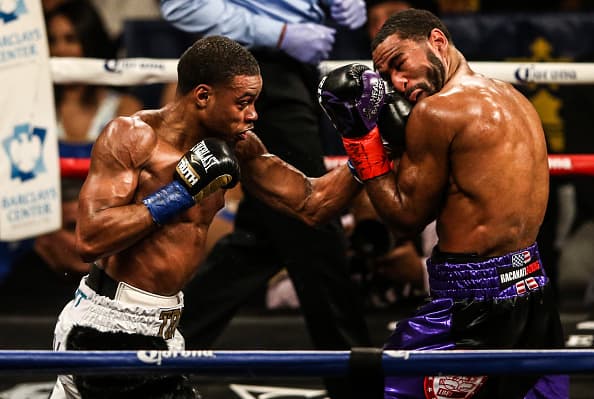 NEW YORK, NY - JANUARY 20: Errol Spence (white trunks) fights Lamont Peterson (purple trunks) on January 20, 2018 at the Barclays Center in Brooklyn neighborhood of New York City. Spence won in the 8th round by technical knockout. (Photo by Anthony Geathers/Getty Images)