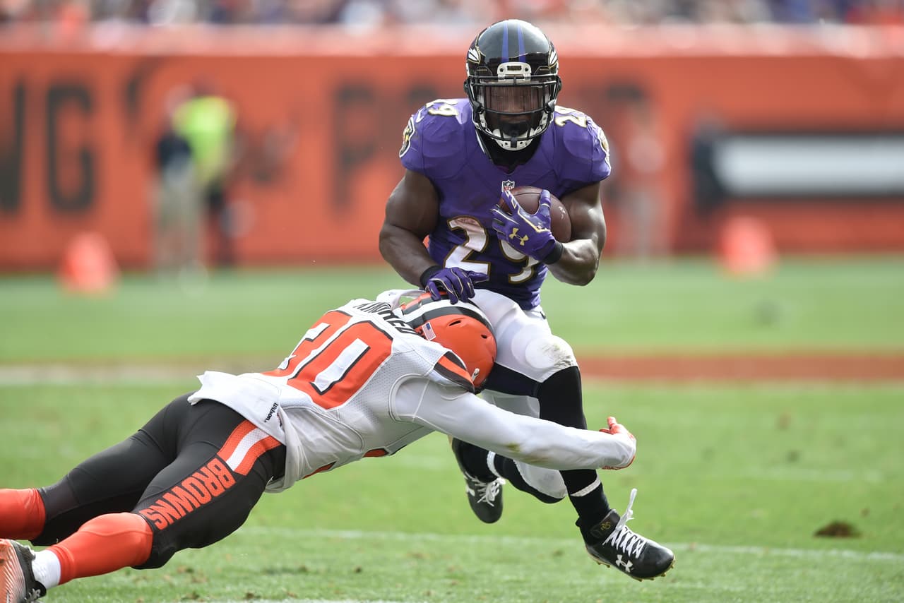 Baltimore Ravens running back Justin Forsett (29) runs against Cleveland Browns free safety Derrick Kindred (30) in the second half of an NFL football game, Sunday, Sept. 18, 2016, in Cleveland. (AP Photo/David Richard)
