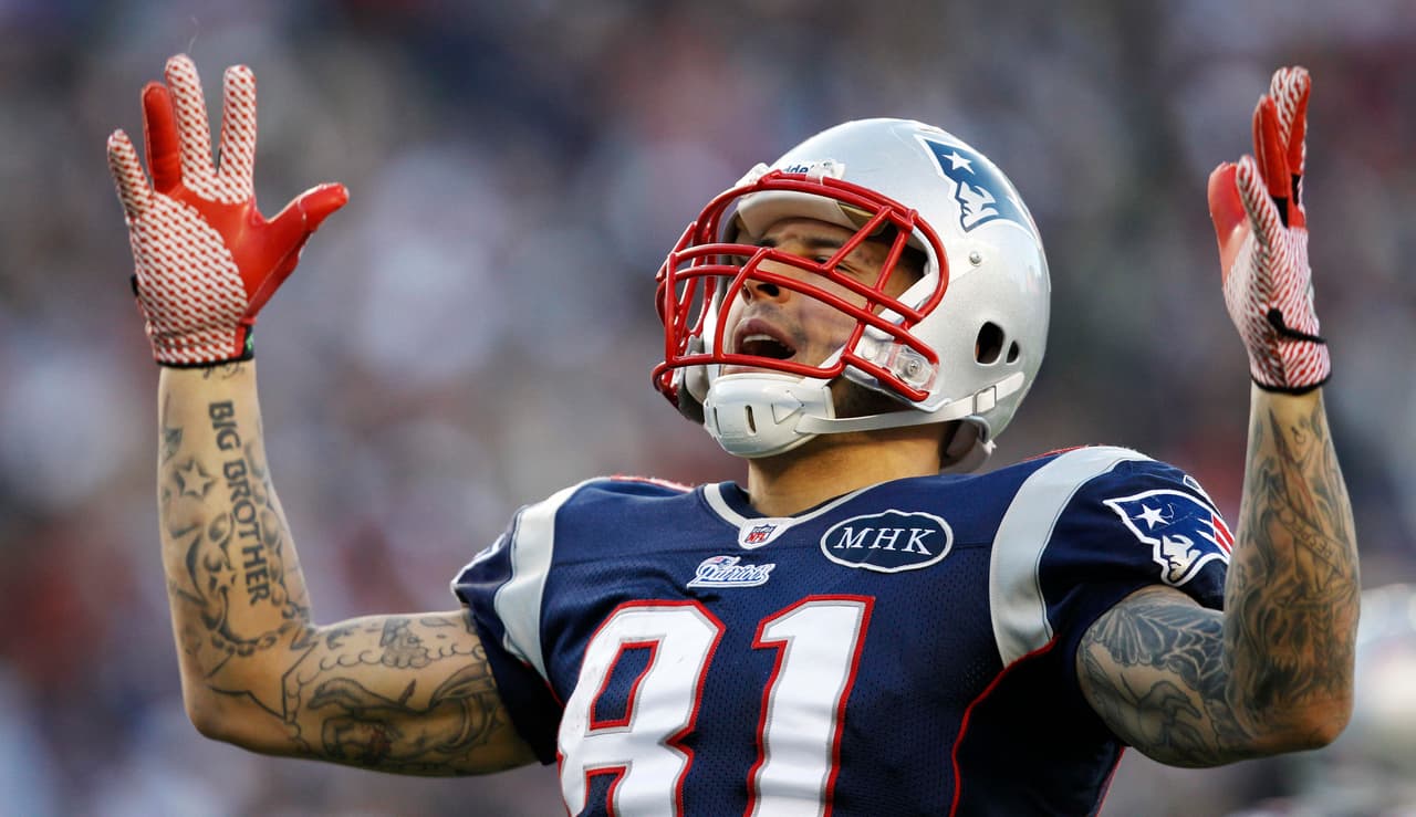 New England Patriots tight end Aaron Hernandez celebrates a long gain to near the goal line, which set up a touchdown, against the Buffalo Bills in the fourth quarter of an NFL football game in Foxborough, Mass., Sunday Jan. 1, 2012. The Patriots won 49-21. (AP Photo/Elise Amendola)