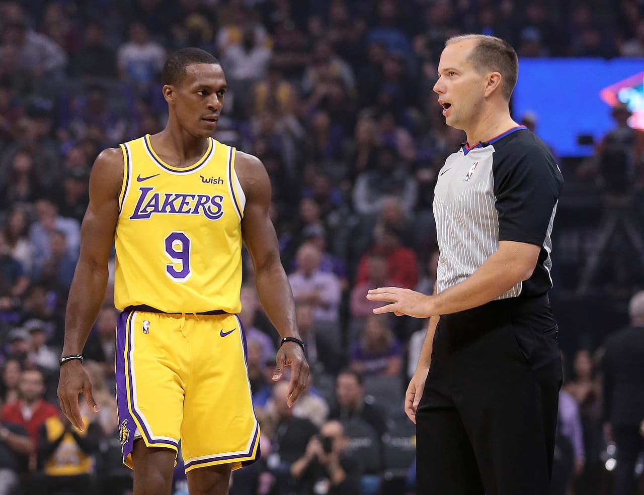Los Angeles Lakers guard Rajon Rondo questions referee John Goble about the technical foul he called against Rondo during the second half of an NBA basketball game against the Sacramento Kings on Saturday, Nov. 10, 2018, in Sacramento, Calif. The Lakers won 101-86. (AP Photo/Rich Pedroncelli)
