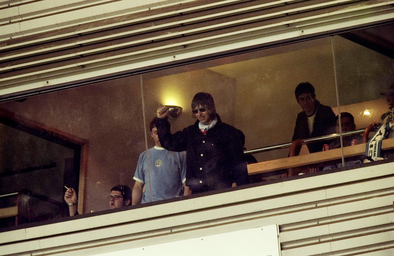 30 May 1999: Oasis rock star Liam Gallagher a devoted Manchester City fan waves to the crowds during the Nationwide Division Two Play-Off Final match against Gillingham played at Wembley Stadium in London, England. The match finished in a 2-2 draw after extra-time and in the penalty shoot-out Manchester City won 3-1 and were promoted to Division One. \ Mandatory Credit: Alex Livesey /Allsport