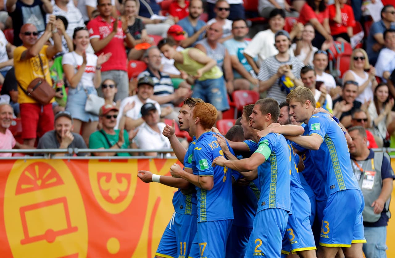 Ukraine's Vladyslav Supriaha, left, celebrates after scoring his side's first goal during the final match between Ukraine and South Korea at the U20 World Cup soccer in Lodz, Poland, Saturday, June 15, 2019. (AP Photo/Sergei Grits)