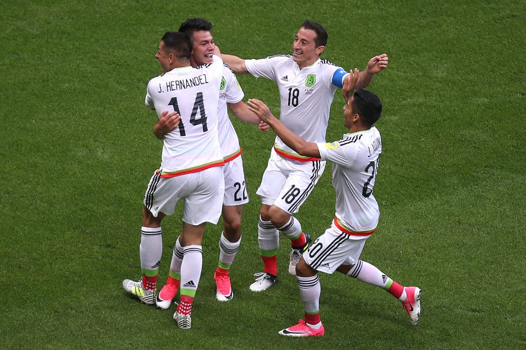 Mexico's forward Hirving Lozano (2nd L) celebrates a second goal during the 2017 Confederations Cup group A football match between Mexico and Russia at the Kazan Arena Stadium in Kazan on June 24, 2017. / AFP PHOTO / Roman Kruchinin (Photo credit should read ROMAN KRUCHININ/AFP/Getty Images)