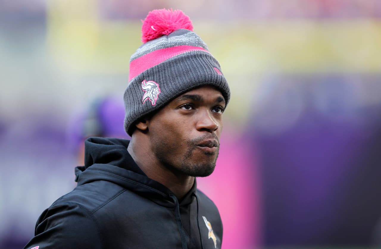 Injured Minnesota Vikings running back Adrian Peterson stands on the sidelines during the second half of an NFL football game against the Houston Texans Sunday, Oct. 9, 2016, in Minneapolis. (AP Photo/Andy Clayton-King)