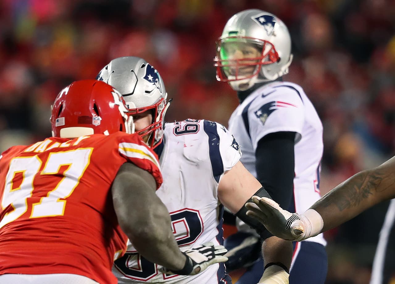 KANSAS CITY, MO - JANUARY 20: What appears to be a green light from a laser pointed from the stands can be seen on the right side of the face of New England Patriots quarterback Tom Brady during a play in the fourth quarter. The NFL has said they are investigating the incident. The Kansas City Chiefs host the New England Patriots in an NFL AFC Championship game at Arrowhead Stadium in Kansas City, MO on Jan. 20, 2019. (Photo by Jim Davis/The Boston Globe via Getty Images)