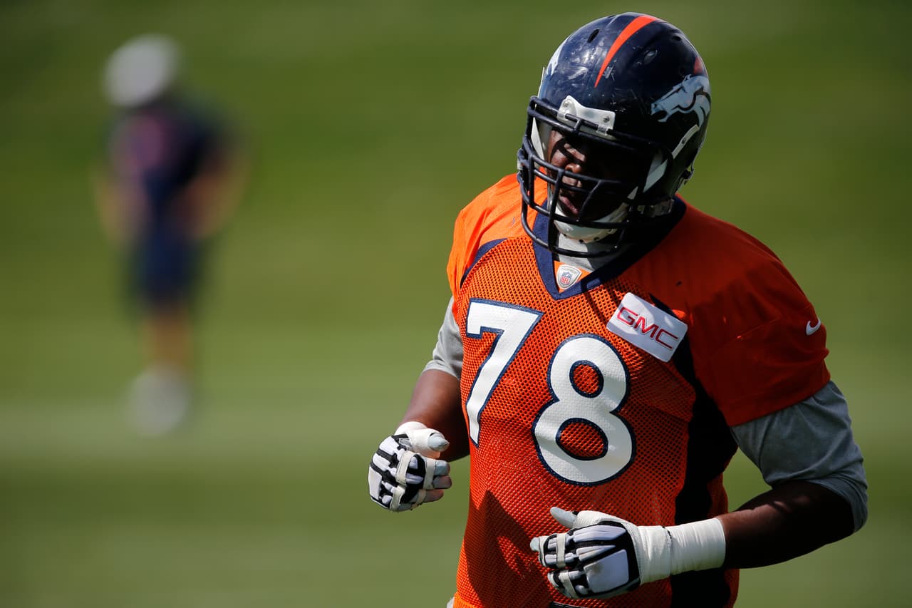 Denver Broncos tackle Ryan Clady runs a drill during a joint practice between the Denver Broncos and the Houston Texans on Thursday, Aug. 21, 2014, in Englewood, Colo. (AP Photo/Jack Dempsey)
