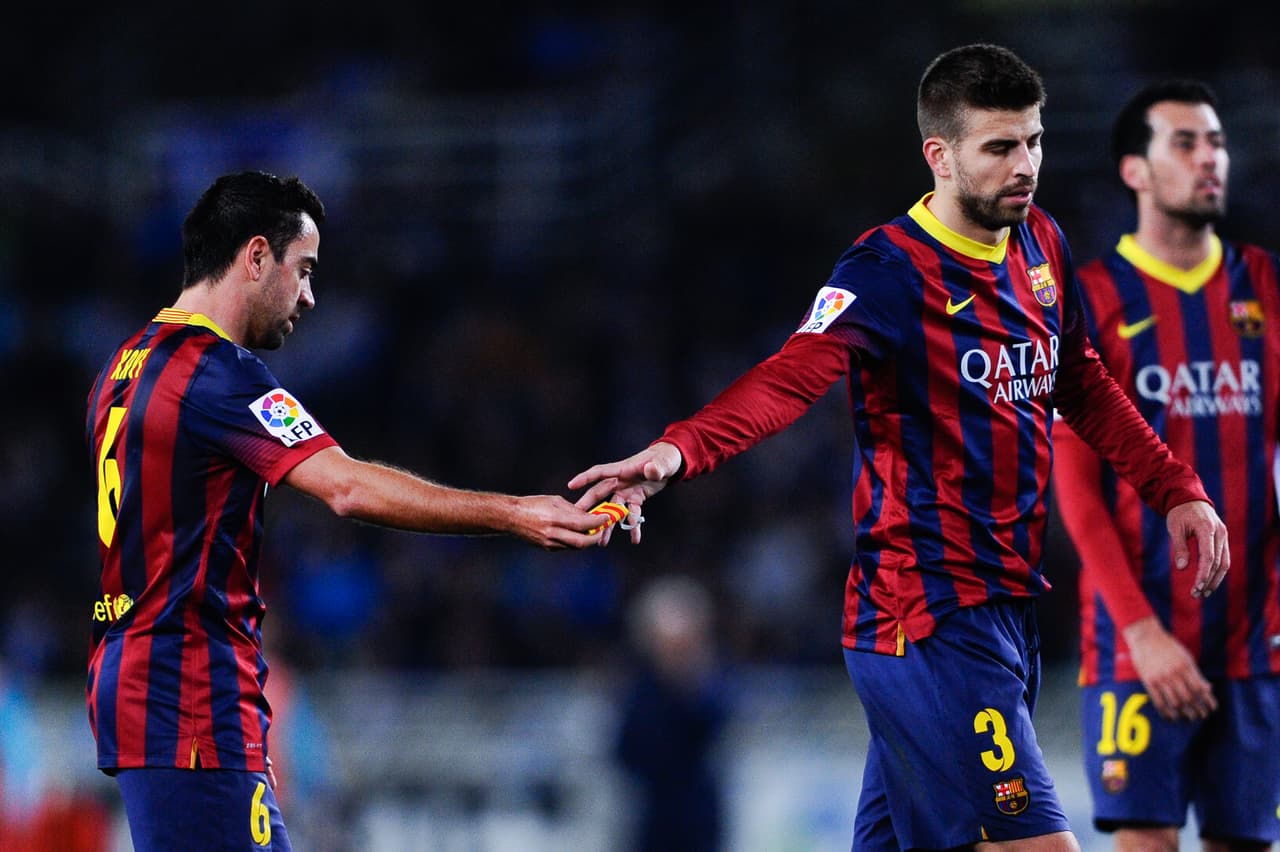 Xavi Hernández y Gerard Piqué