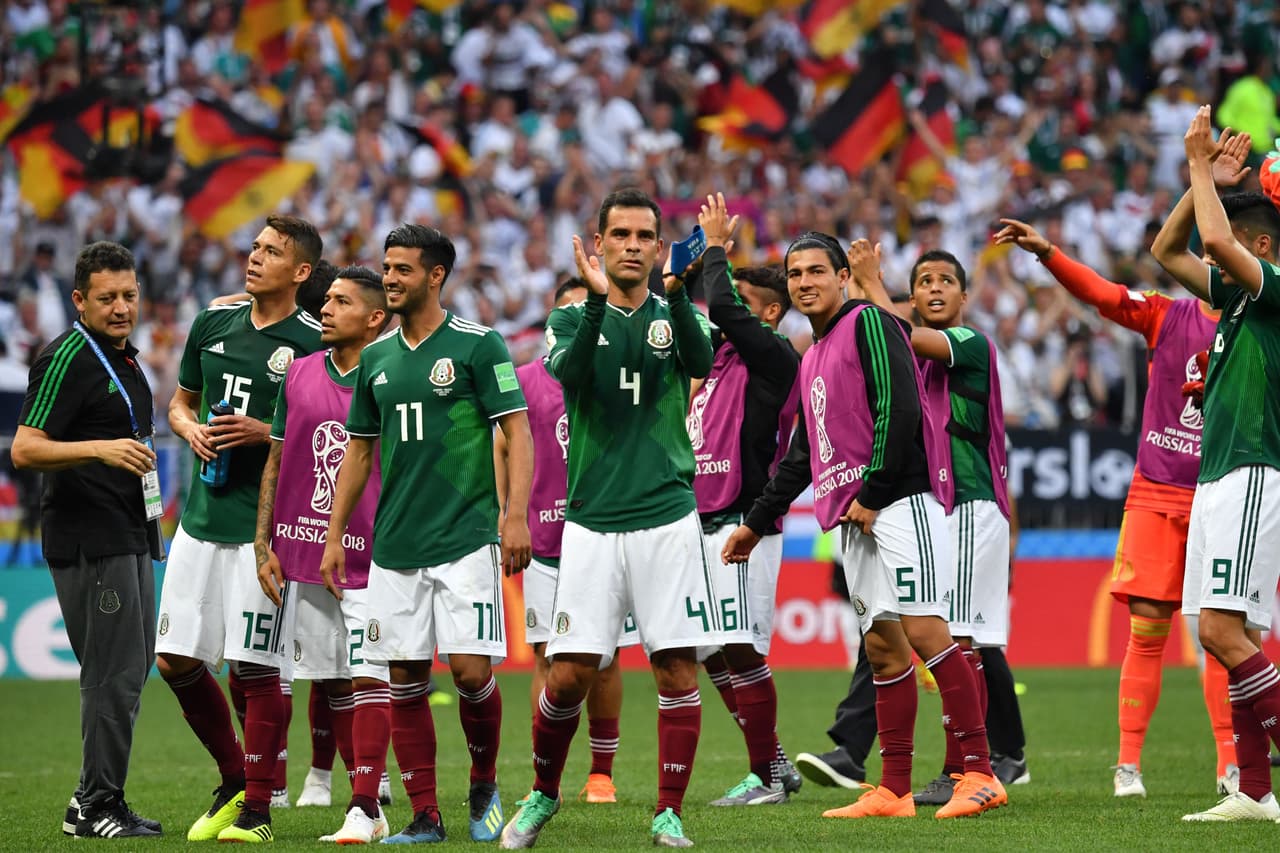 (FromL) Mexico's defender Hector Moreno, Mexico's goalkeeper Alfredo Talavera, Mexico's forward Carlos Vela, Mexico's midfielder Rafael Marquez and Mexico's defender Erick Gutierrez celebrate their 1-0 victory at the end of the Russia 2018 World Cup Group F football match between Germany and Mexico at the Luzhniki Stadium in Moscow on June 17, 2018. (Photo by Yuri CORTEZ / AFP) / RESTRICTED TO EDITORIAL USE - NO MOBILE PUSH ALERTS/DOWNLOADS / The erroneous mention[s] appearing in the metadata of this photo by Yuri CORTEZ has been modified in AFP systems in the following manner: Erick Gutierrez] instead of [Diego Reyes]. Please immediately remove the erroneous mention[s] from all your online services and delete it (them) from your servers. If you have been authorized by AFP to distribute it (them) to third parties, please ensure that the same actions are carried out by them. Failure to promptly comply with these instructions will entail liability on your part for any continued or post notification usage. Therefore we thank you very much for all your attention and prompt action. We are sorry for the inconvenience this notification may cause and remain at your disposal for any further information you may require. (Photo credit should read YURI CORTEZ/AFP/Getty Images)