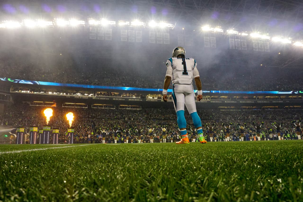 Carolina Panthers quarterback Cam Newton (1) watches the Seattle Seahawks enter the field prior to an NFL game against the Seattle Seahawks, Sunday, Dec. 4, 2016 in Seattle. (Margaret Bowles via AP)
