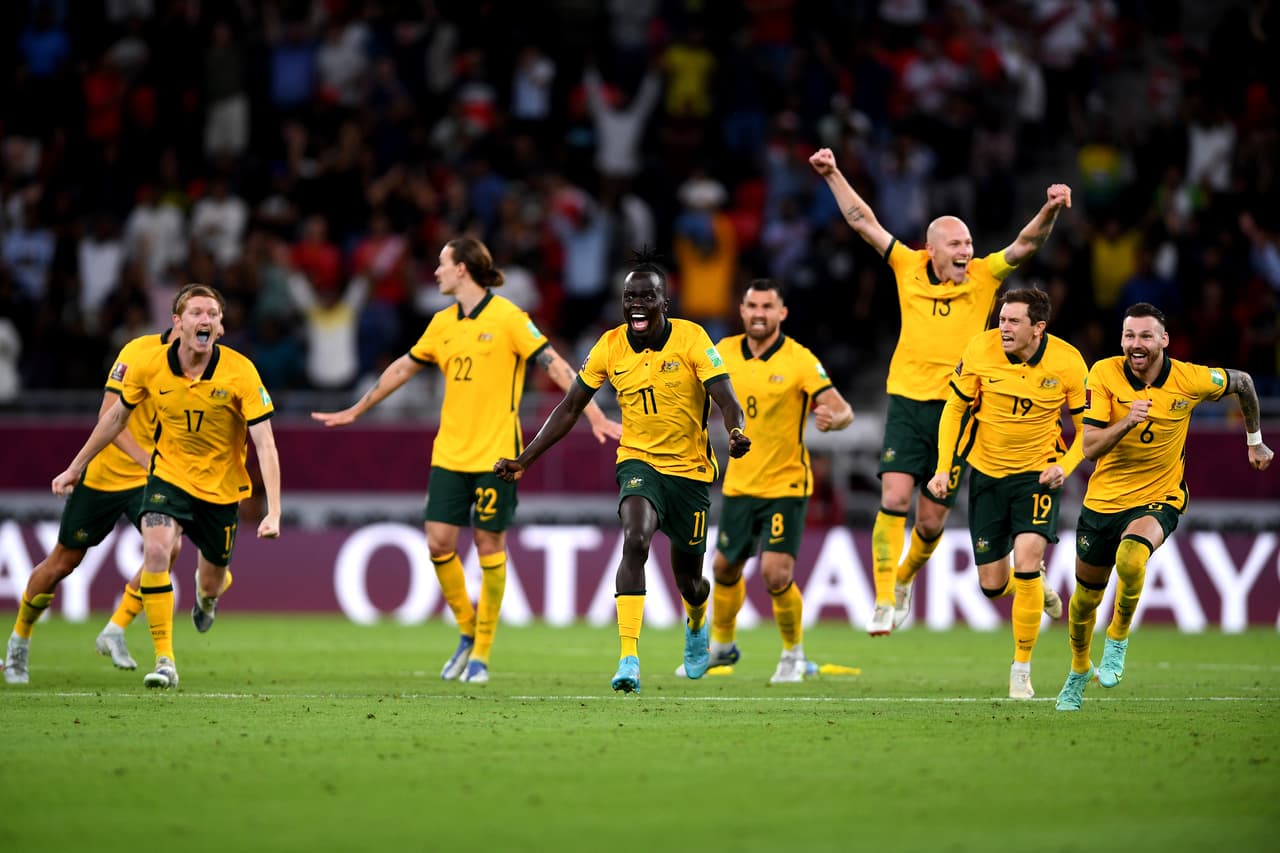 DOHA, QATAR - JUNE 13: Australia celebrate after defeating Peru in the 2022 FIFA World Cup Playoff match between Australia Socceroos and Peru at Ahmad Bin Ali Stadium on June 13, 2022 in Doha, Qatar. (Photo by Joe Allison/Getty Images)