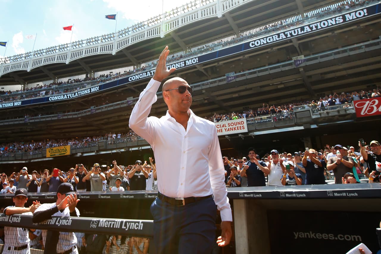 NEW YORK, NY - AUGUST 14: Former New York Yankee Derek Jeter acknowledges the crowd as he is introduced during a ceremony honoring Mariano Rivera before a game between the Tampa Bay Rays and the New York Yankees at Yankee Stadium on August 14, in the Bronx borough of New York City. (Photo by Rich Schultz/Getty Images)