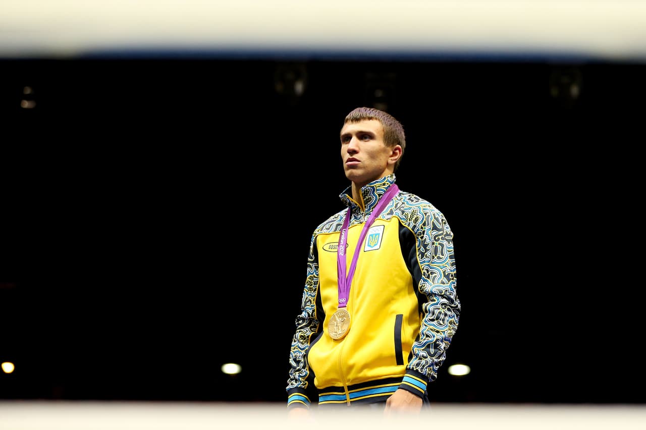 LONDON, ENGLAND - AUGUST 12: Gold medalist Vasyl Lomachenko of Ukraine celebrates on the podium during the medal ceremony for the Men's Light (60kg) Boxing final bout on Day 16 of the London 2012 Olympic Games at ExCeL on August 12, 2012 in London, England. (Photo by Scott Heavey/Getty Images)