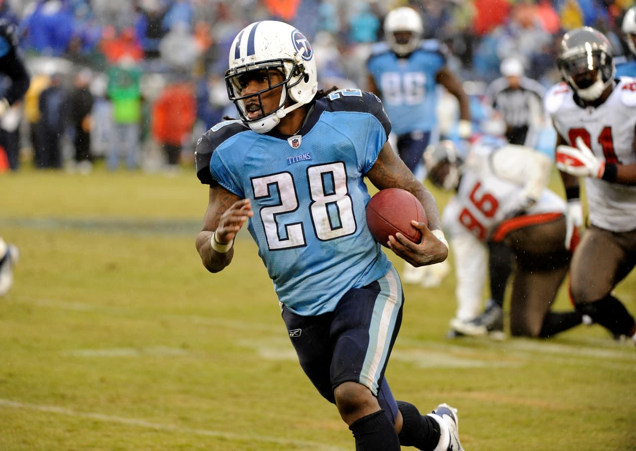 Tennessee Titans running back Chris Johnson (28) carries the ball against the Tampa Bay Buccaneers in the fourth quarter of an NFL football game on Sunday, Nov. 27, 2011, in Nashville, Tenn. The Titans won 23-17.(AP Photo/Frederick Breedon)