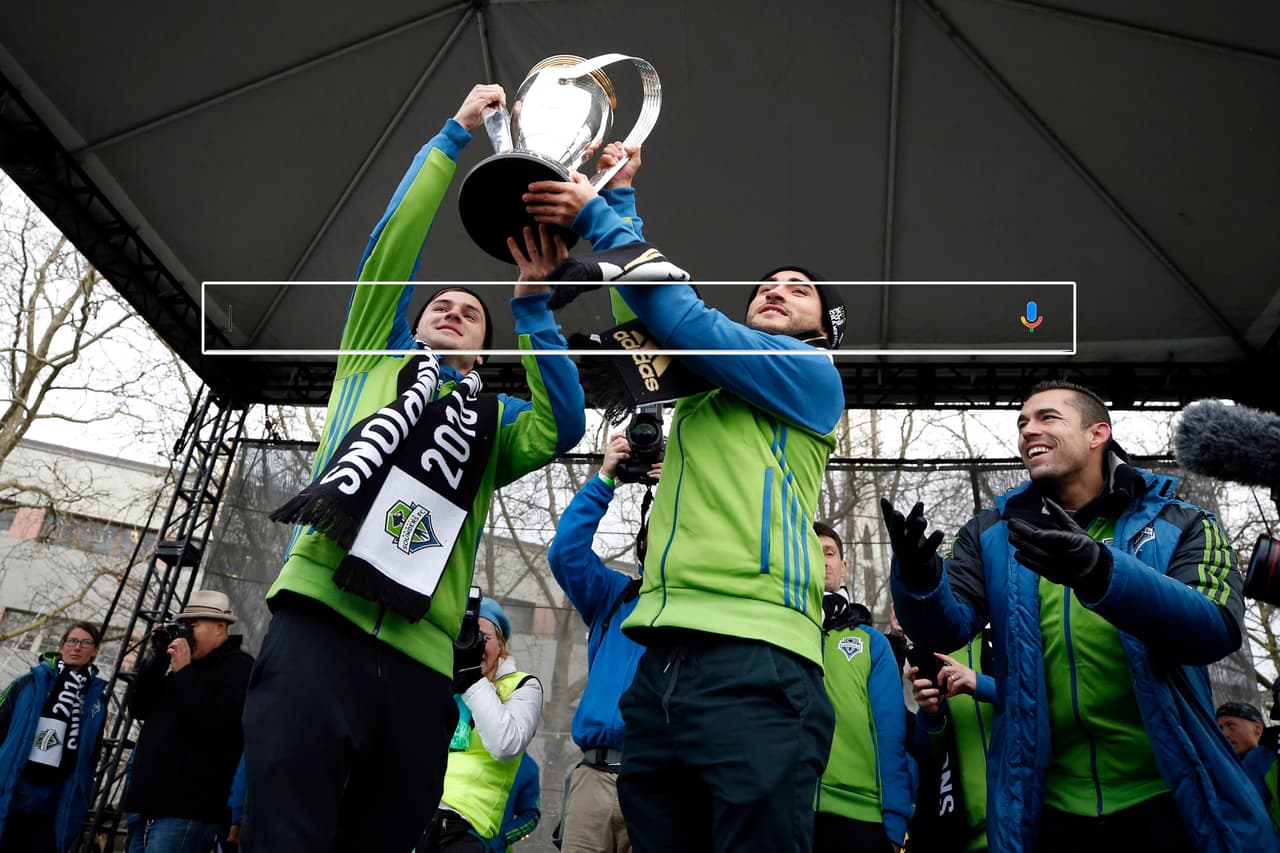 Dec 13, 2016; Seattle, WA, USA; Seattle Sounders FC forward Jordan Morris (13, left) and midfielder Cristian Roldan (7) hold the MLS Cup championship trophy during a at Seattle Center. Seattle Sounders FC midfielder Herculez Gomez (9) is at right. Mandatory Credit: Joe Nicholson-USA TODAY Sports