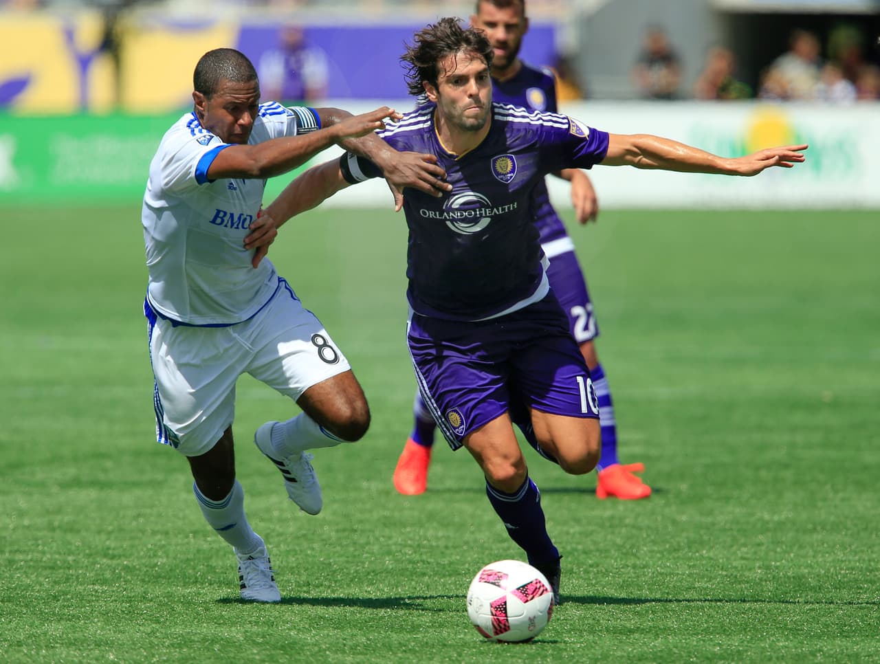 Oct 2, 2016; Orlando, FL, USA; Montreal Impact midfielder Patrice Bernier (8) and Orlando City FC midfielder Kaka (10) battle for the ball during the first half of a soccer match at Camping World Stadium. Mandatory Credit: Reinhold Matay-USA TODAY Sports