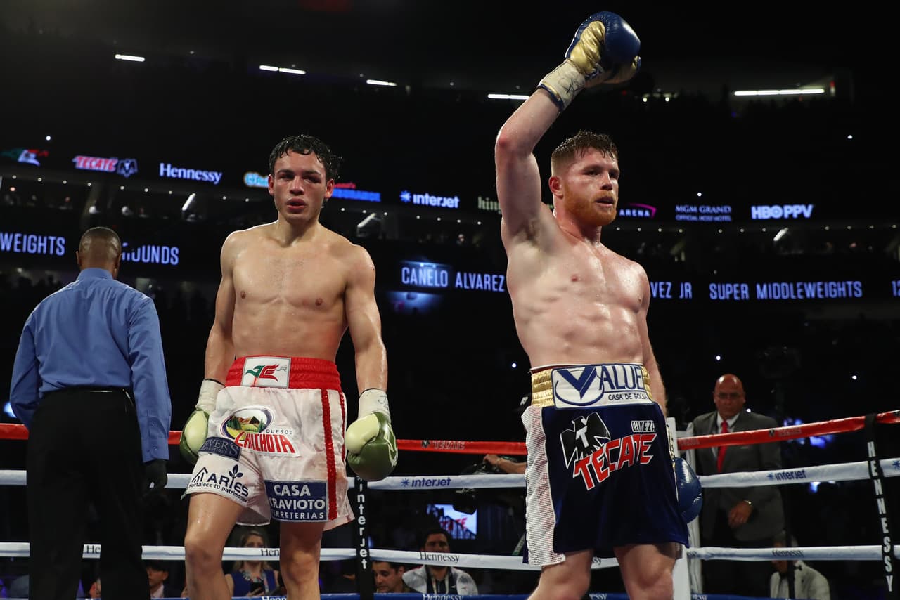 LAS VEGAS, NV - MAY 06: Canelo Alvarez (R) celebrates after going twelve rounds against Julio Cesar Chavez Jr. during their catchweight bout at T-Mobile Arena on May 6, 2017 in Las Vegas, Nevada. Alvarez won by unanimous decision. (Photo by Al Bello/Getty Images)