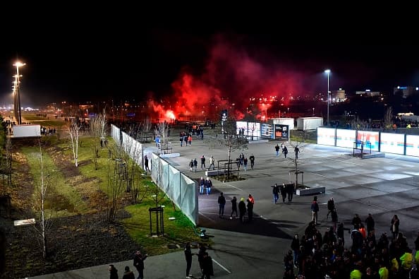 Lyon's fans use red flares before before the Europa League football match Olympique Lyonnais (OM) vs CSKA Moscow on March 15, 2018, at the Groupama Stadium in Decines-Charpieu, central-eastern France. / AFP PHOTO / ROMAIN LAFABREGUE (Photo credit should read ROMAIN LAFABREGUE/AFP/Getty Images)