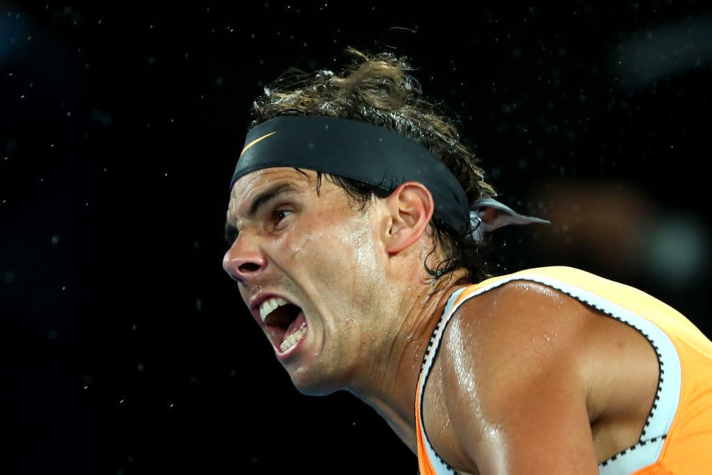 MELBOURNE, AUSTRALIA - JANUARY 27: Rafael Nadal of Spain serves in his Men's Singles Final match against Novak Djokovic of Serbia during day 14 of the 2019 Australian Open at Melbourne Park on January 27, 2019 in Melbourne, Australia. (Photo by Michael Dodge/Getty Images)