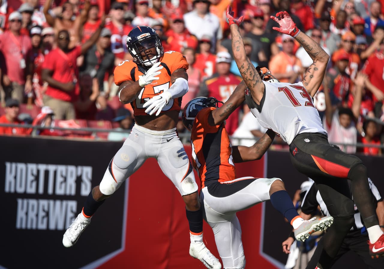 Denver Broncos safety T. J. Ward (43) defends against a pass attempt to Tampa Bay Buccaneers wide receiver Mike Evans (13) during a week four NFL football game in Tampa, Fla. Denver won 27 - 7. (Al Messerschmidt via AP)