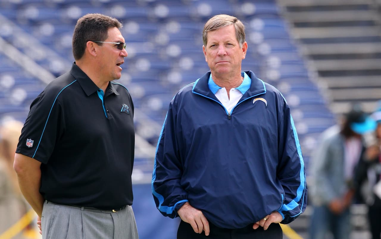 Carolina Panthers head coach Ron Rivera and San Diego Chargers head coach Norv Turner talk before an NFL game against the San Diego Chargers on December 16, 2012. The Panthers defeated the Chargers 31-7. (AP Photo/Kevin Terrell)