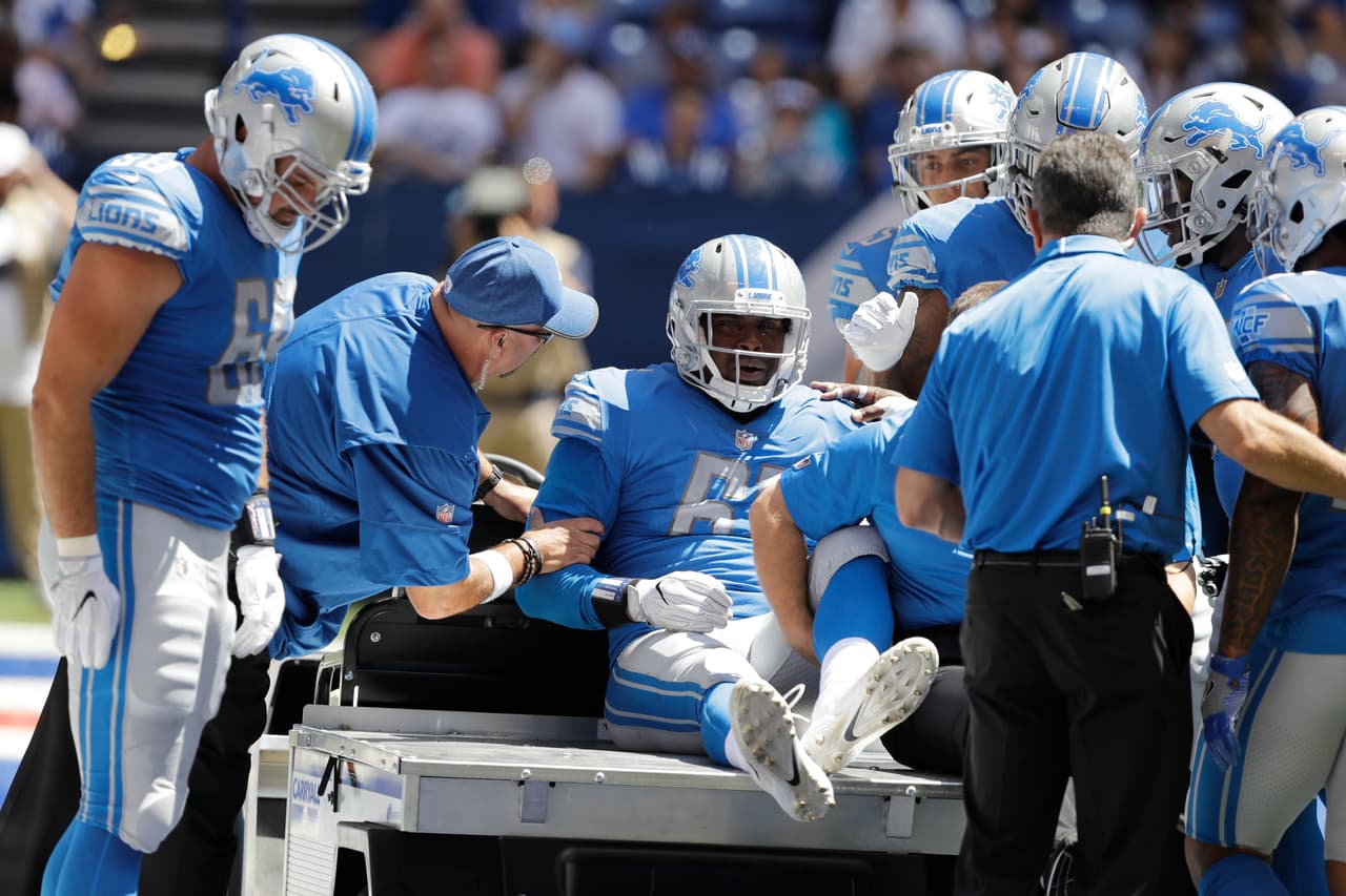 Detroit Lions defensive end Kerry Hyder (61) is taken off the field after being injured during the first half of an NFL preseason football game against the Indianapolis Colts Sunday, Aug. 13, 2017, in Indianapolis. (AP Photo/Darron Cummings)