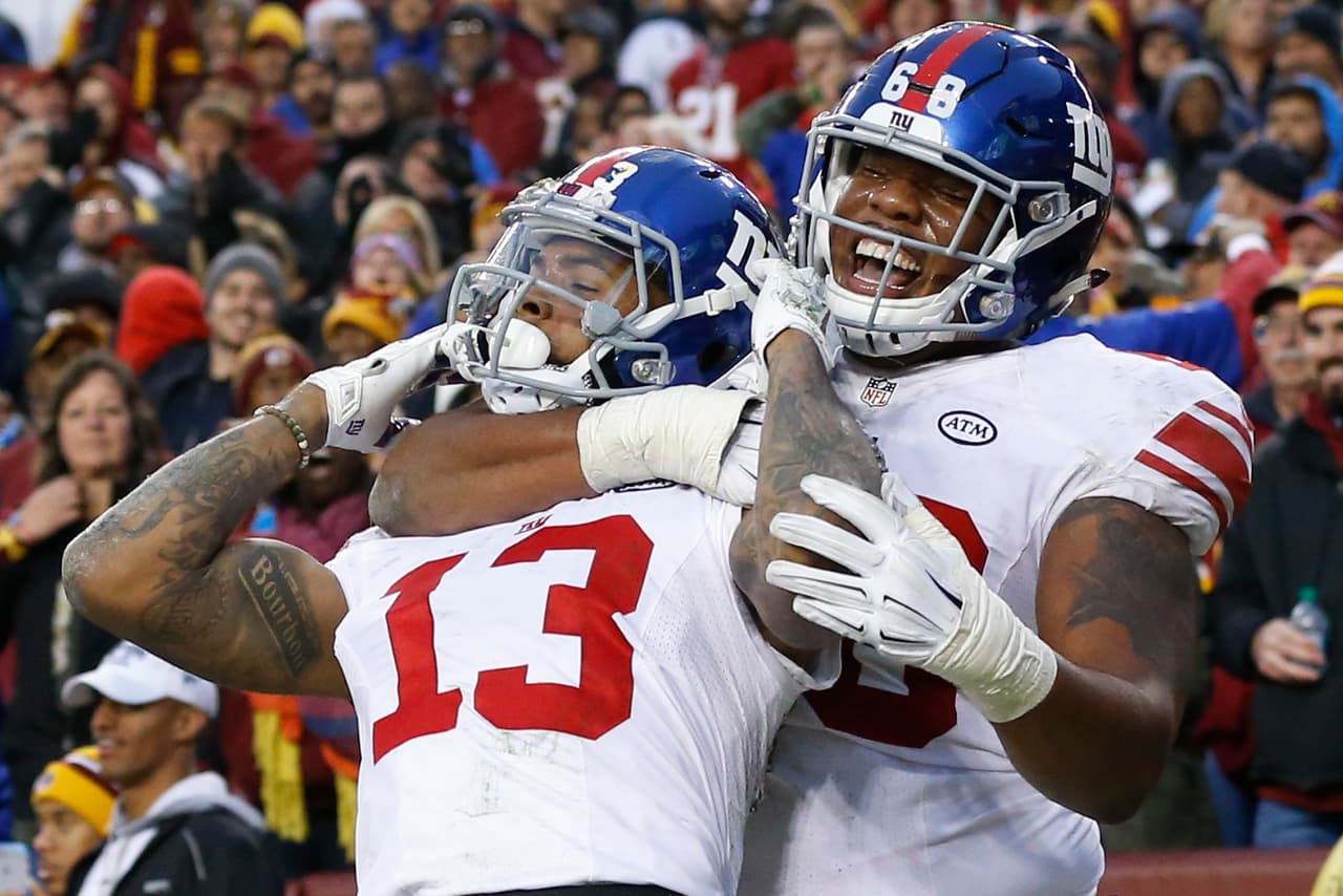 Los Washington Redskins empataron a los New York Giants al tope del Este de la NFC al vencerlos 20-14 en la semana 12, estas son las mejores imágenes de este reñido encuentro.