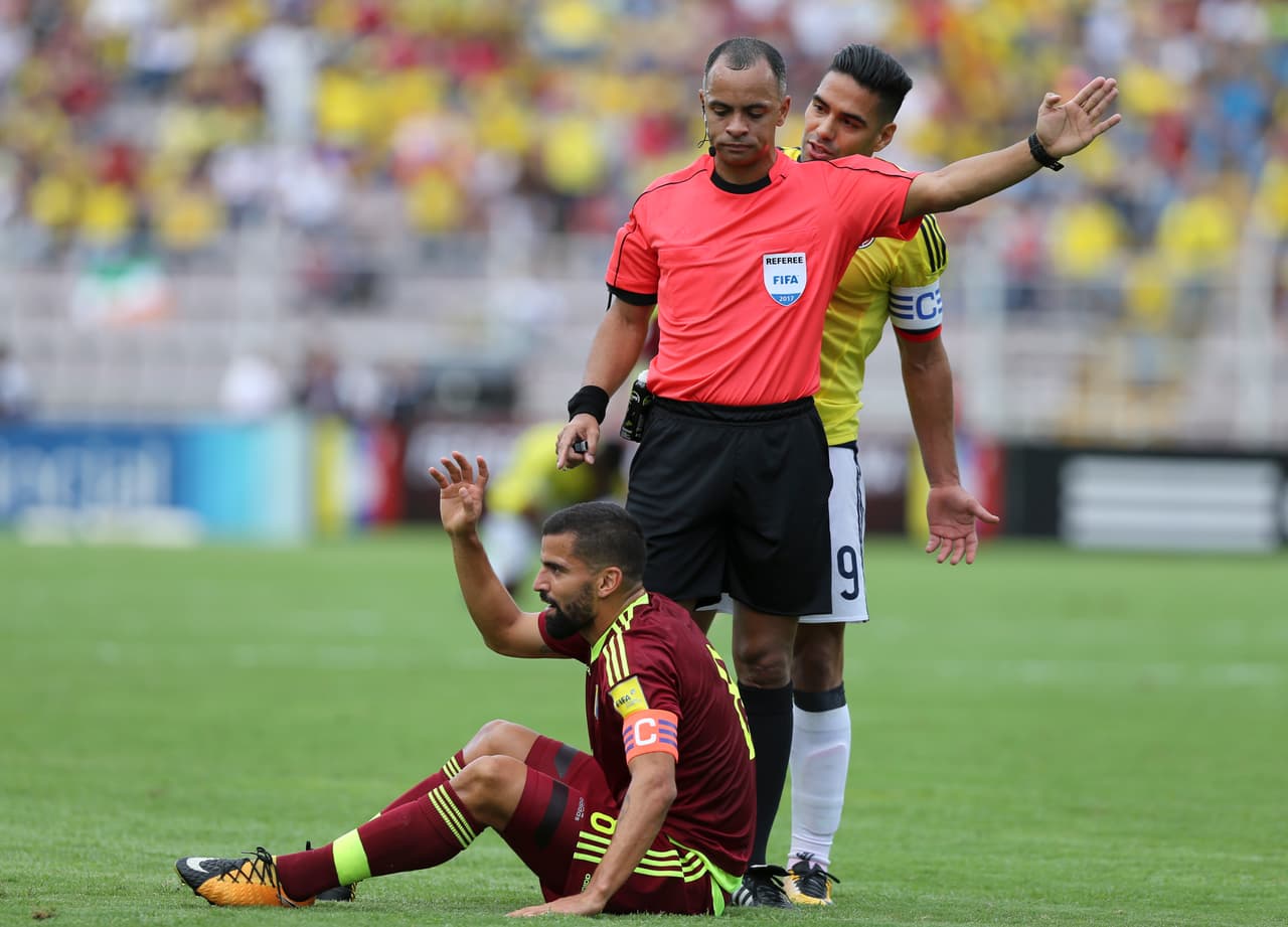 Colombia's captain Radamel Falcao Garcia argues with referee Wilton Pereira Sampaio, of Brazil, as he calls a foul on Venezuela's captain Tomas Rincon during a 2018 Russia World Cup qualifying soccer match in San Cristobal, Venezuela, Thursday, Aug. 31, 2017. (AP Photo/Fernando Llano)