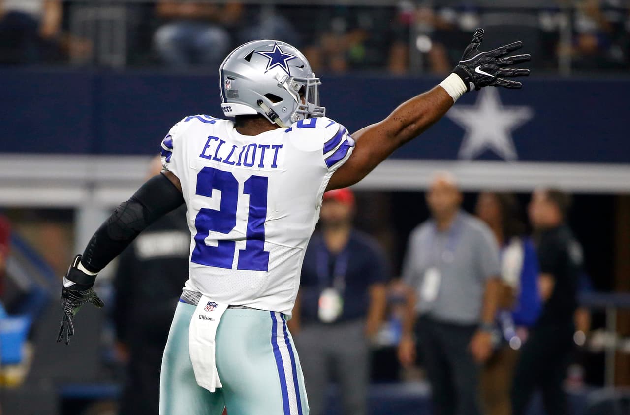 Dallas Cowboys running back Ezekiel Elliott (21) signals first down after a run against the Oakland Raiders in the first half of a preseason NFL football game, Saturday, Aug. 26, 2017, in Arlington, Texas. (AP Photo/Ron Jenkins)