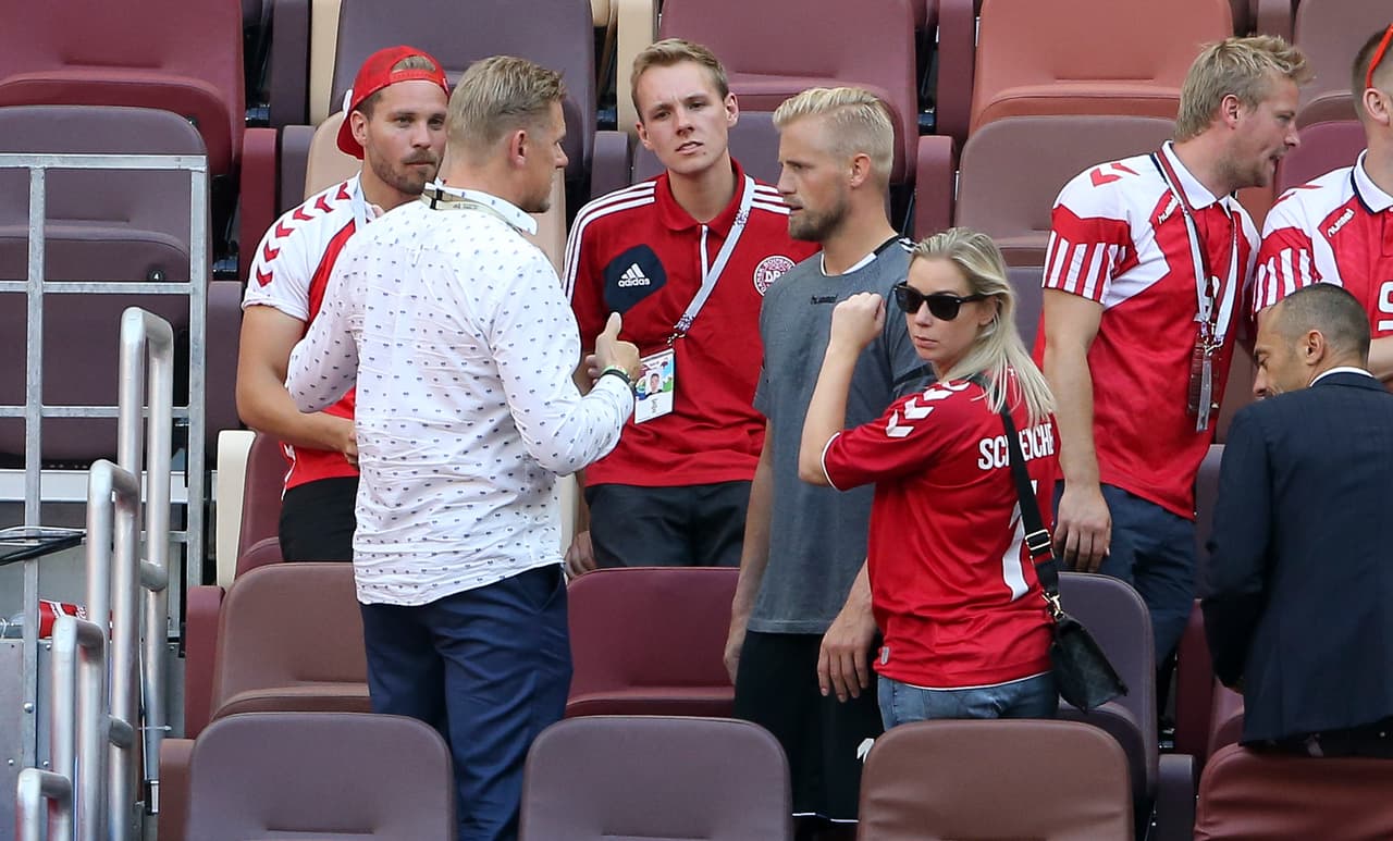 MOSCOW, RUSSIA - JUNE 26: Danish players meet family members - goalkeeper of Denmark Kasper Schmeichel between his father Peter Schmeichel and his wife Stine Gyldenbrand - following the 2018 FIFA World Cup Russia group C match between Denmark and France at Luzhniki Stadium on June 26, 2018 in Moscow, Russia. (Photo by Jean Catuffe/Getty Images)