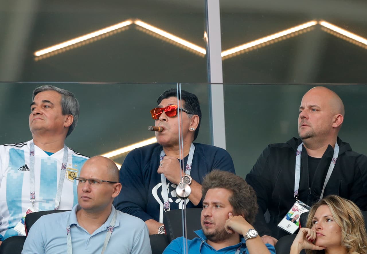 Former soccer star Diego Maradona, center, watches the group D match between Argentina and Iceland at the 2018 soccer World Cup in the Spartak Stadium in Moscow, Russia, Saturday, June 16, 2018. (AP Photo/Ricardo Mazalan)
