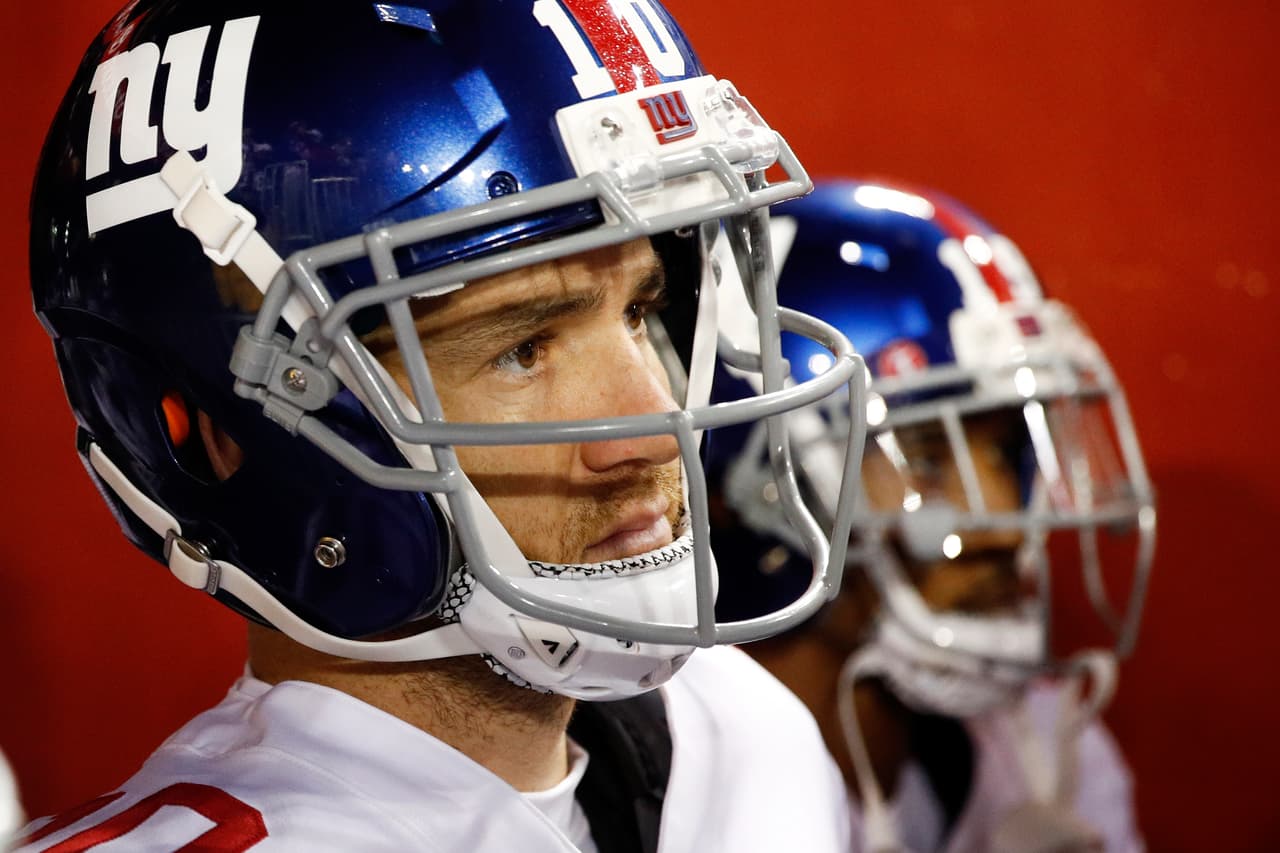 New York Giants quarterback Eli Manning (10) walks through the tunnel before an NFL football game against the Washington Redskins in Landover, Md., Thursday, Nov. 23, 2017. (AP Photo/Patrick Semansky)