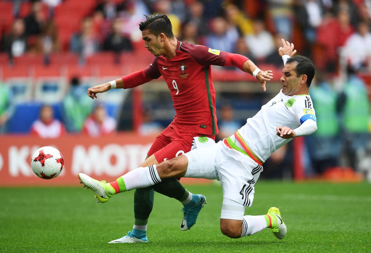 MOSCOW, RUSSIA - JULY 02: Rafael Marquez of Mexico fouls Andre Silva of Portugal and a penalty is awrded during the FIFA Confederations Cup Russia 2017 Play-Off for Third Place between Portugal and Mexico at Spartak Stadium on July 2, 2017 in Moscow, Russia. (Photo by Laurence Griffiths/Getty Images)