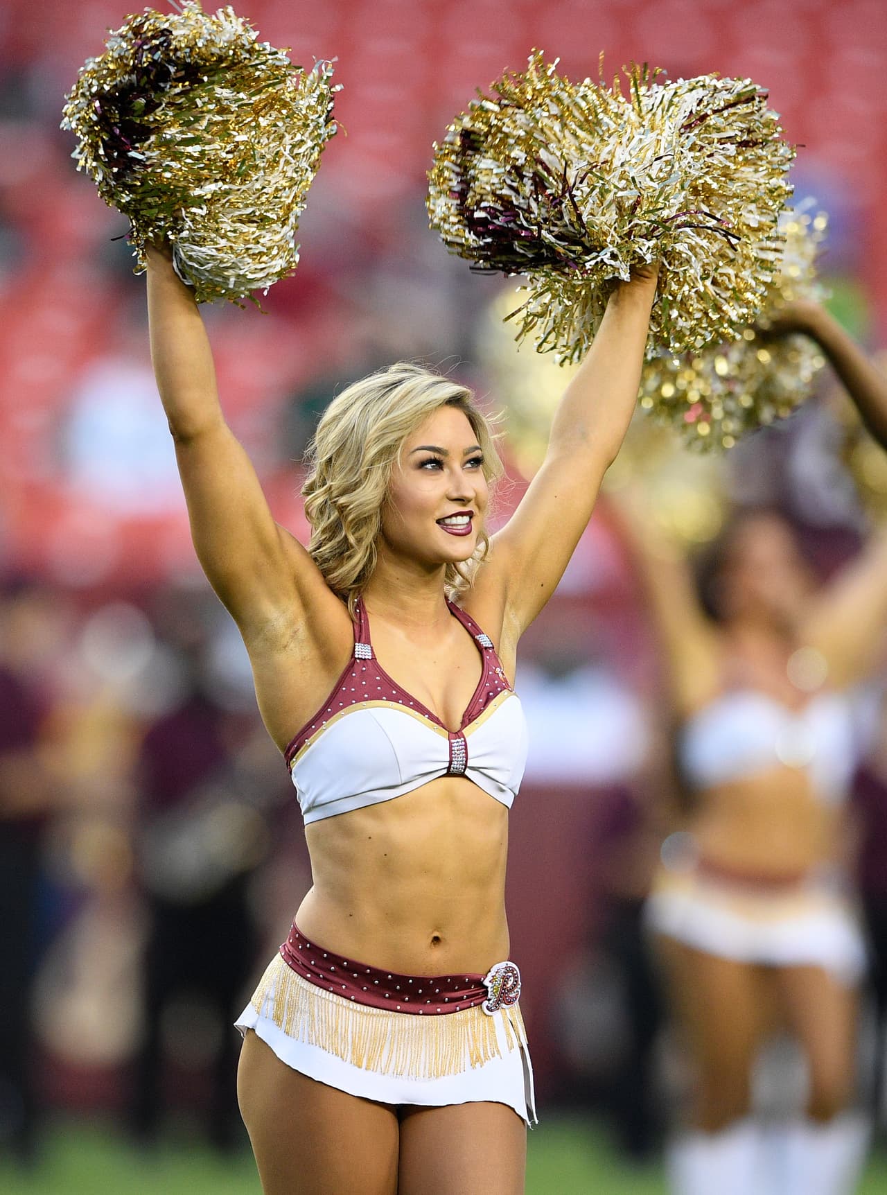 The Washington Redskins cheerleaders perform before a preseason NFL football game against the New York Jets, Thursday, Aug. 16, 2018, in Landover, Md. (AP Photo/Nick Wass)