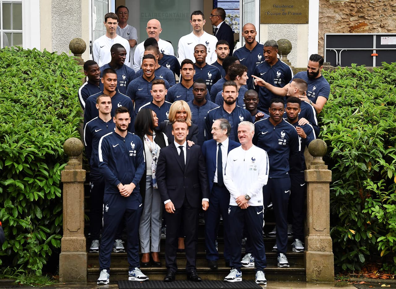 French President Emmanuel Macron (C), his wife Brigitte Macron (C, 2nd row), French Sports Minister Laura Flessel (2ndL), French Football Federation (FFF) President Noel Le Graet (2ndR) and France's head coach Didier Deschamps (R) pose with France national football team players in Clairefontaine-en-Yvelines on June 5, 2018. - France's players are in Clairefontaine-en-Yvelines as part of the team's preparation for the upcoming FIFA Football World Cup 2018 in Russia. (Photo by FRANCK FIFE / AFP) (Photo credit should read FRANCK FIFE/AFP/Getty Images)