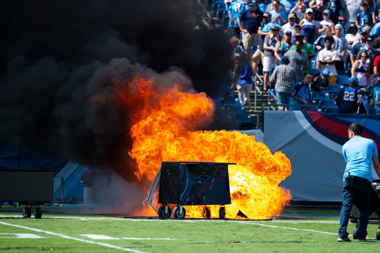 NASHVILLE, TN - SEPTEMBER 15: A failed pyrotechnic device bursts into flames before the game between the Tennessee Titans and the Indianapolis Colts at Nissan Stadium on September 15, 2019 in Nashville, Tennessee. (Photo by Brett Carlsen/Getty Images)