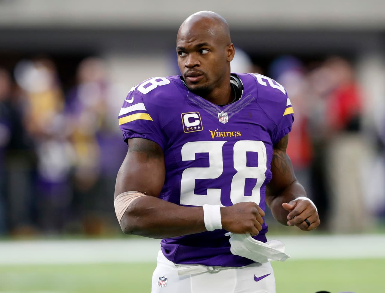 Minnesota Vikings running back Adrian Peterson warms up before the start of an NFL football game between the Indianapolis Colts and the Minnesota Vikings Sunday, Dec. 18, 2016, in Minneapolis. (AP Photo/Charlie Neibergall)