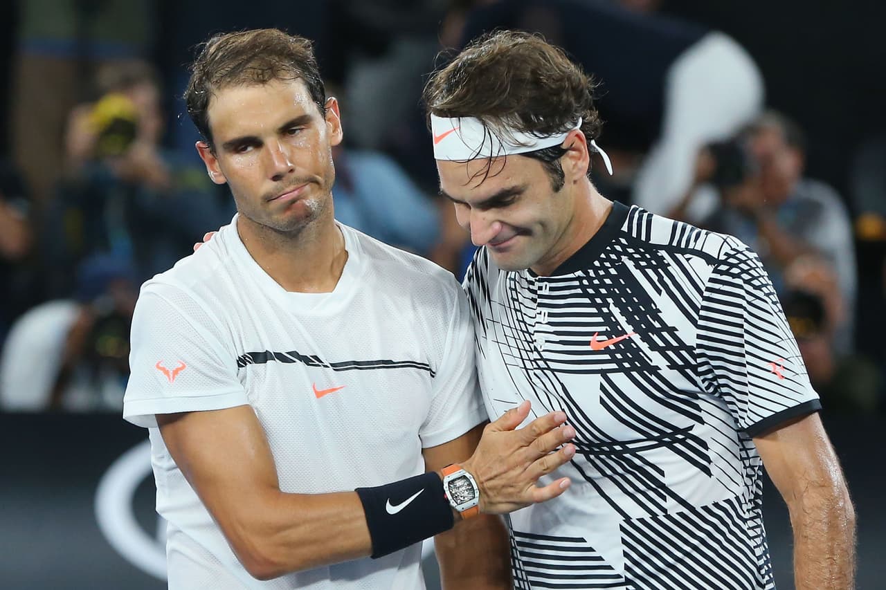 MELBOURNE, AUSTRALIA - JANUARY 29: Roger Federer of Switzerland (R) celebrates winning in the Men's Final match against Raphael Nadal of Spain on day 14 of the 2017 Australian Open at Melbourne Park on January 29, 2017 in Melbourne, Australia. (Photo by Michael Dodge/Getty Images)