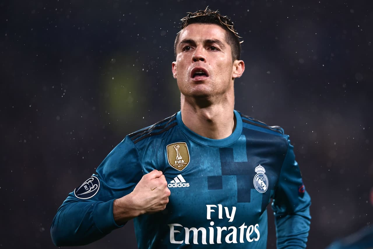 Real Madrid's Portuguese forward Cristiano Ronaldo celebrates his second goal during the UEFA Champions League quarter-final first leg football match between Juventus and Real Madrid at the Allianz Stadium in Turin on April 3, 2018. / AFP PHOTO / Marco BERTORELLO (Photo credit should read MARCO BERTORELLO/AFP/Getty Images)