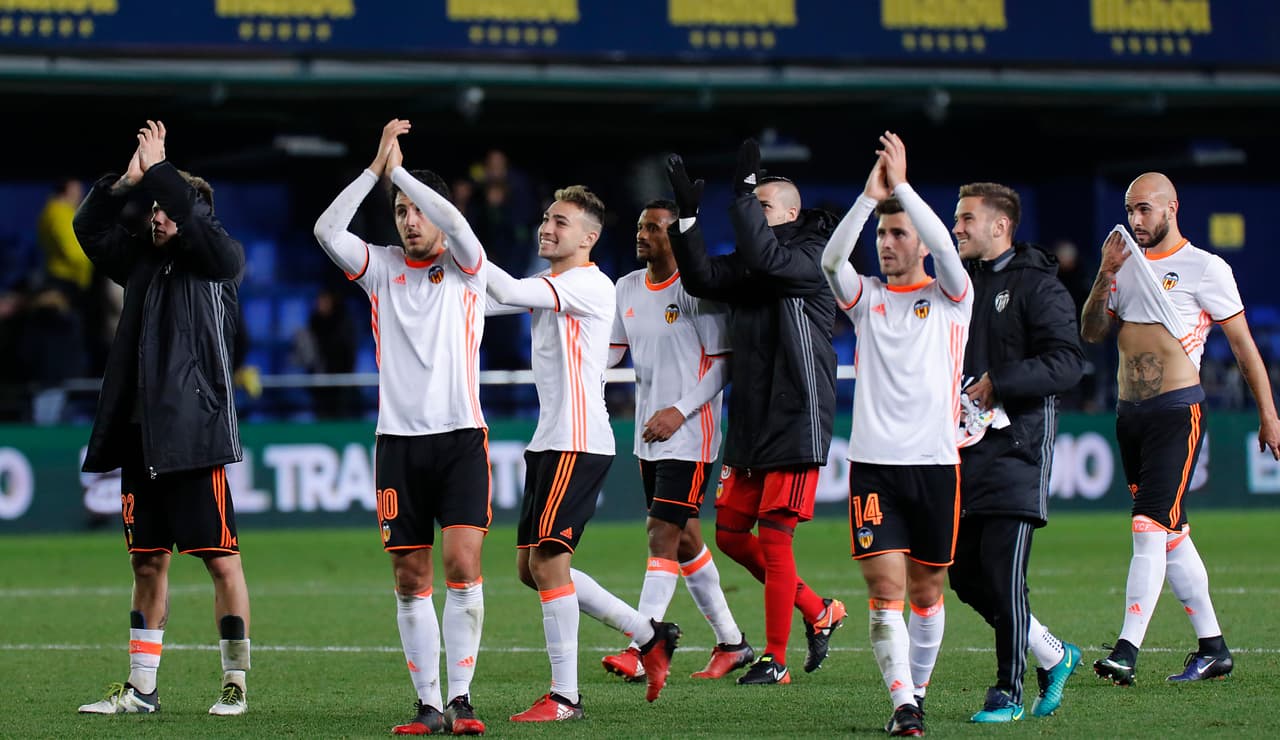 Valencia's player celebrate their victory at the end of the Spanish League football match Villarreal CF vs Valencia CF at La Ceramica stadium in Vila-real on January 21, 2017. Valencia won 2-0. / AFP / JOSE JORDAN (Photo credit should read JOSE JORDAN/AFP/Getty Images)