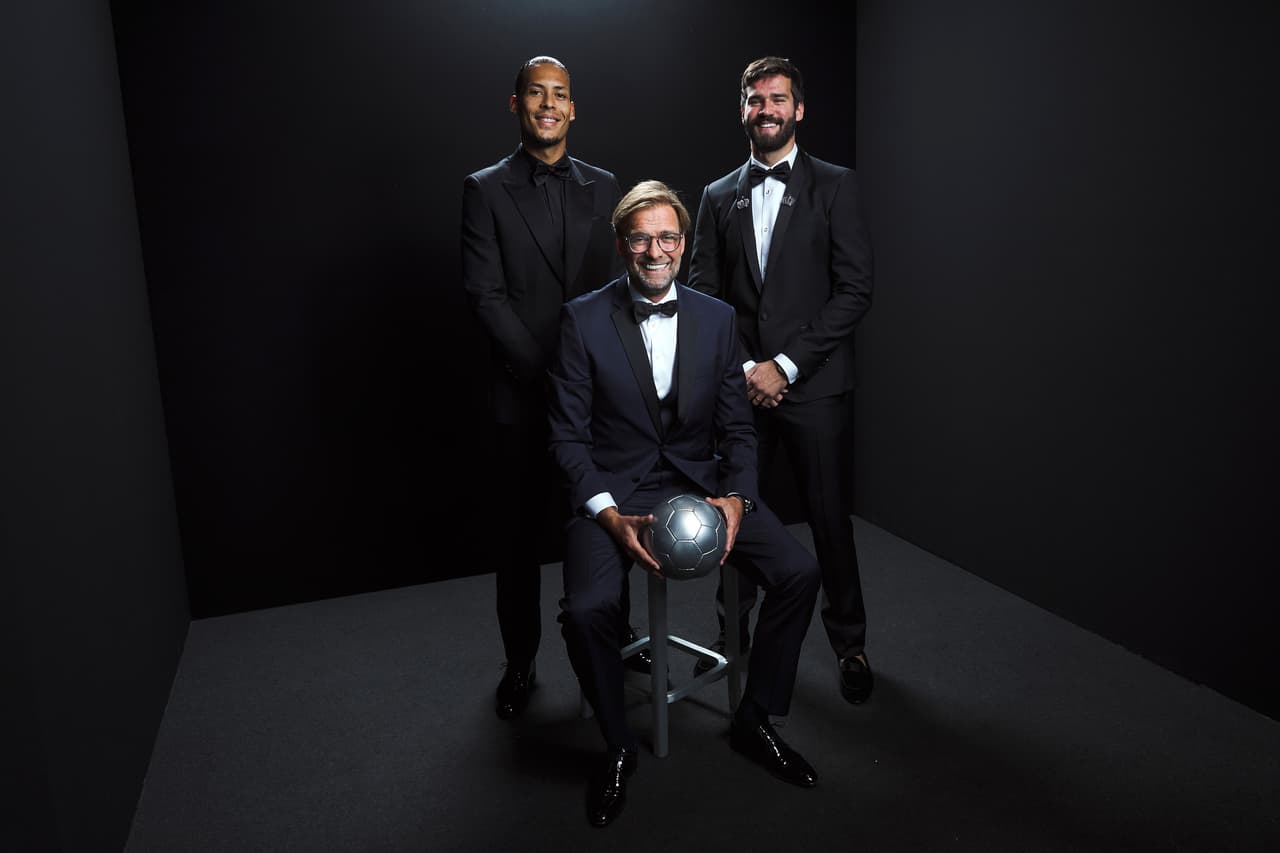 MILAN, ITALY - SEPTEMBER 23: (L-R) The Best FIFA Men’s Player Award finalist Virgil Van Dijk of Liverpool and Netherlands, The Best FIFA Men’s Coach Award finalist Jurgen Klopp, Head Coach of Liverpool and The Best FIFA Men's Goalkeeper Award finalist Alisson Becker of Liverpool and Brazil pose for a portrait in the photo booth prior to The Best FIFA Football Awards 2019 at Excelsior Hotel Gallia on September 23, 2019 in Milan, Italy. (Photo by Michael Regan - FIFA/FIFA via Getty Images)